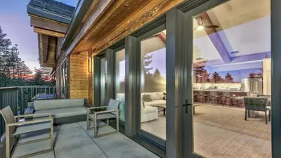 a sliding glass door on a patio with a couch at Zalanta 313 in South Lake Tahoe