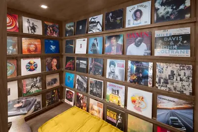 a room with a bunch of movies on the wall at evo Hotel Tahoe City in Tahoe City