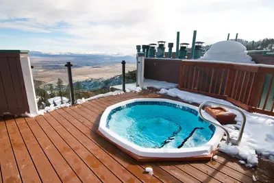 a hot tub sitting on a deck in the snow at The Ridge Sierra in Stateline