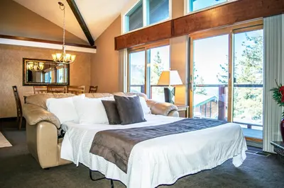 a bedroom with a bed and a large window at Tahoe Chaparral in Incline Village