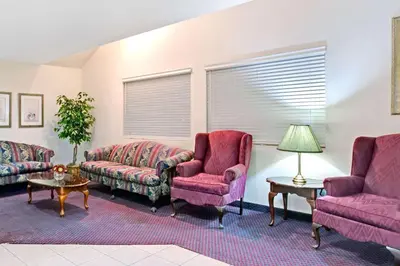 a living room with two couches and two chairs at Microtel Inn & Suites, Morgan Hill in Morgan Hill