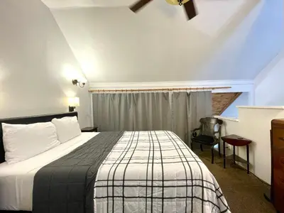 a hotel room with a bed and a window at Sierra Mountain Lodge - Vacation Rentals - Yosemite in Ahwahnee