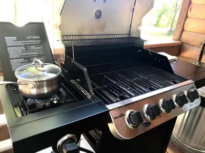 a grill with a pot on top of it at Sierra Mountain Lodge - Vacation Rentals - Yosemite in Ahwahnee