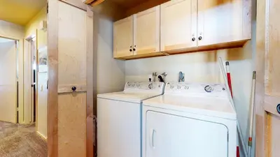 a white washer and dryer in a small kitchen at Snowcreek 622 Condo in Mammoth Lakes