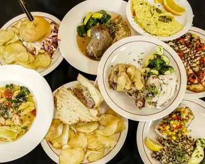 a group of plates of food on a table at Freeport Wine Country Inn in Freeport