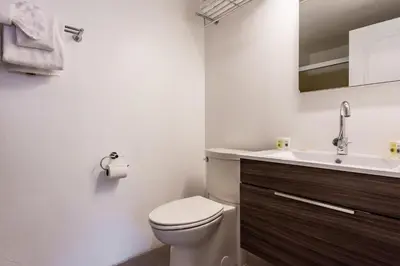 a bathroom with a toilet and a sink at Courchevel C # 9 in Mammoth Lakes