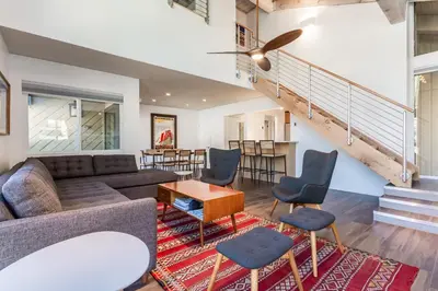 a living room with a couch and chairs and a table at Courchevel C # 9 in Mammoth Lakes