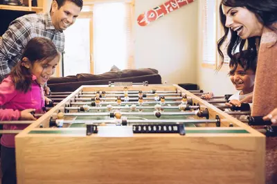 a family playing a game of billiards at 3160 Aspen Grove in Truckee