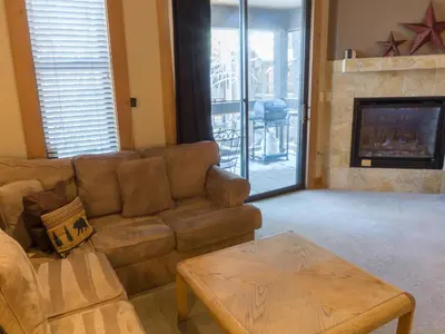 a living room with a couch and a fireplace at 3130 Aspen Grove in Truckee