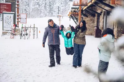 a group of people standing in the snow at 3174 Aspen Grove in Truckee