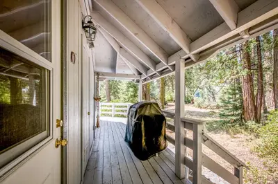 a bag sitting on a porch of a house at Sparrow Cove in Shaver Lake