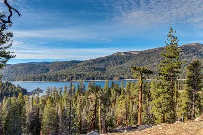 a view of a lake in the mountains at Sparrow Cove in Shaver Lake