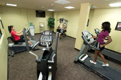 a group of people riding on tread machines in a gym at Jackson Rancheria Casino Resort in Jackson
