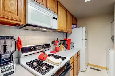 a kitchen with a stove and a refrigerator at Sierra Sky in Tahoe City