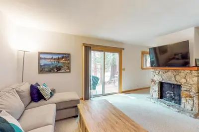 a living room with a couch and a fireplace at Sierra Sky in Tahoe City