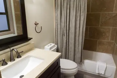 a bathroom with a sink and a toilet and a shower at 3159 Aspen Grove in Truckee