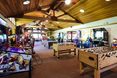 a room with several arcade games and consoles at 3159 Aspen Grove in Truckee