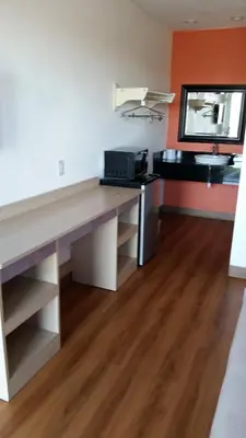 a kitchen with a desk and a sink in a room at Motel 6 Lost Hills / Buttonwillow Racetrack in Lost Hills