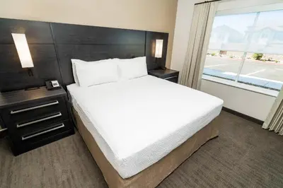 a bedroom with a large bed and a window at Residence Inn by Marriott Reno Sparks in Sparks
