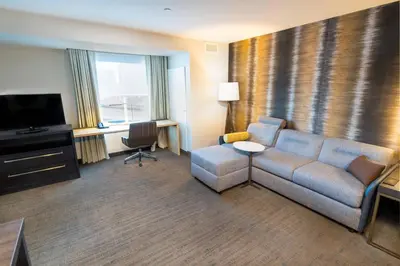 a living room with a couch and a television at Residence Inn by Marriott Reno Sparks in Sparks