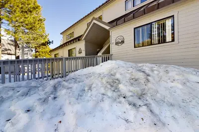 a pile of snow in front of a house at Eagles Nest Condo #88 in Lakeshore