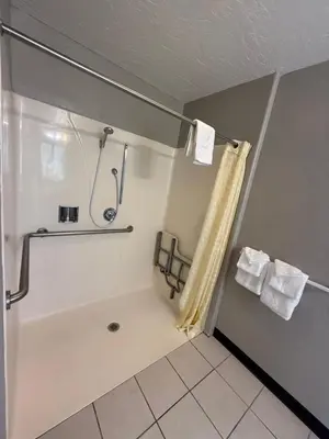 a bathroom with a shower and a bath tub at Tahoe Sands Inn in South Lake Tahoe