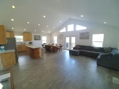 a large living room with a couch and a table at Mountain Place in Groveland