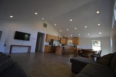 a living room with a kitchen and a dining room at Mountain Place in Groveland