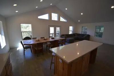 a kitchen and living room with a table and chairs at Mountain Place in Groveland