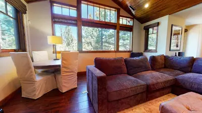a living room with a couch and a table at Gray Stone Condo #2110 in Mammoth Lakes