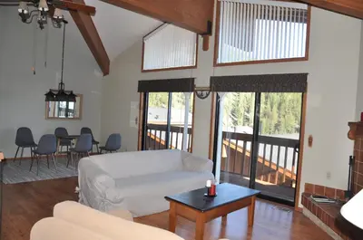 a living room with a couch and a table at Bitterbrush - 400 Fairview Boulevard - very close to Diamond Peak and beaches - WSTR21-0086 - Tax ID W4900 - Max 7 people, 2 cars parking in carports in Incline Village