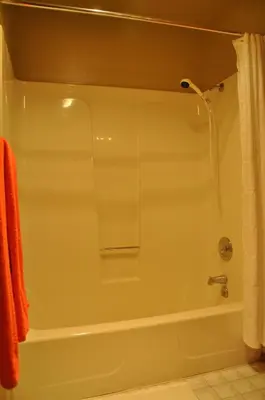 a bathroom with a bath tub with a shower at Bitterbrush - 400 Fairview Boulevard - very close to Diamond Peak and beaches - WSTR21-0086 - Tax ID W4900 - Max 7 people, 2 cars parking in carports in Incline Village