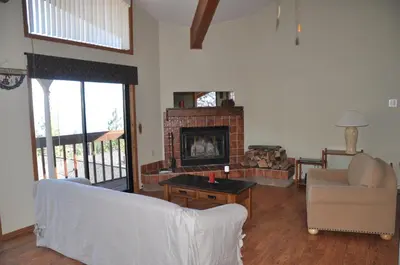 a living room with a couch and a fireplace at Bitterbrush - 400 Fairview Boulevard - very close to Diamond Peak and beaches - WSTR21-0086 - Tax ID W4900 - Max 7 people, 2 cars parking in carports in Incline Village