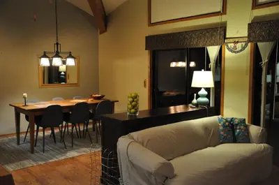 a living room with a couch and a dining room at Bitterbrush - 400 Fairview Boulevard - very close to Diamond Peak and beaches - WSTR21-0086 - Tax ID W4900 - Max 7 people, 2 cars parking in carports in Incline Village