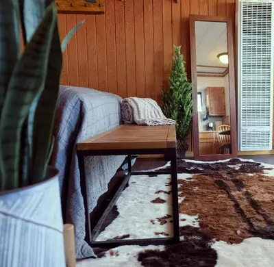 a living room with a couch and a coffee table at Lake Front Cabins in June Lake