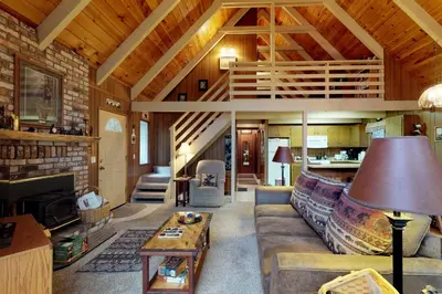a living room with a couch and a table at Bears Meadow in Arnold