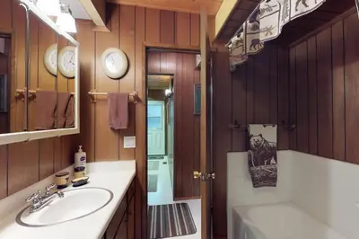 a bathroom with a sink and a tub and a toilet at Bears Meadow in Arnold