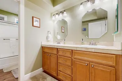 a bathroom with a sink and a mirror at Cypress Lodge in Arnold