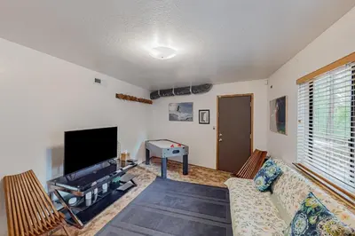 a living room with a couch and a flat screen tv at Mitthas Tapovan in Arnold