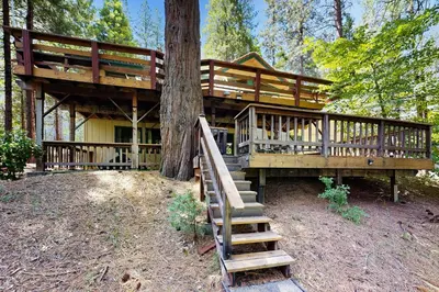 a large tree house with stairs leading up to it at On The 9th in Arnold