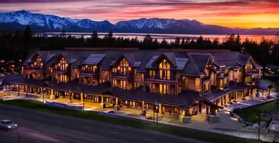 an aerial view of a large house with mountains in the background at Zalanta 319 in South Lake Tahoe