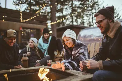 a group of people sitting around a fire at Zalanta 319 in South Lake Tahoe