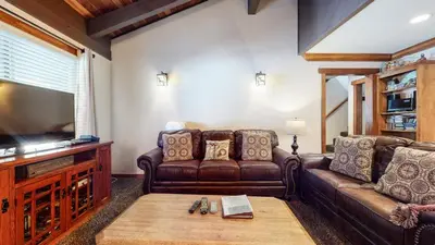 a living room with a couch and a television at Horizons Condo 4 #168 in Mammoth Lakes