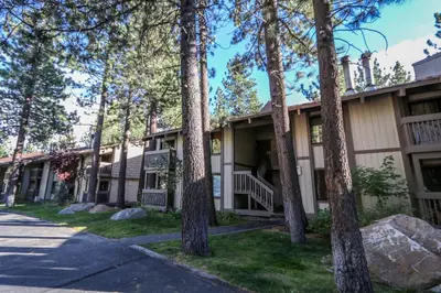 a building with trees in front of it at Horizons Condo 4 #168 in Mammoth Lakes