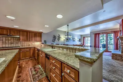 a large kitchen with wooden cabinets and granite counter tops at R110 Timber Ridge in Kirkwood