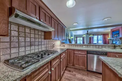 a kitchen with wooden cabinets and a stove top oven at R110 Timber Ridge in Kirkwood