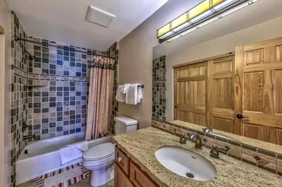 a bathroom with a sink and a tub and a toilet at R110 Timber Ridge in Kirkwood