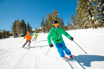 a group of people skiing down a snow covered slope at R110 Timber Ridge in Kirkwood