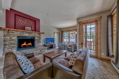 a living room with a couch and a fireplace at R101 Timber Ridge in Kirkwood