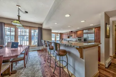 a kitchen with a bar and a dining room at R101 Timber Ridge in Kirkwood